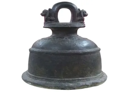 Large bronze bell with a looped handle