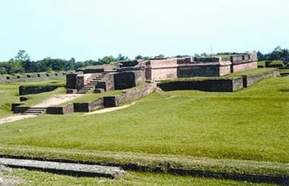 Excavated brick walls of Salban Vihara on a grassy site